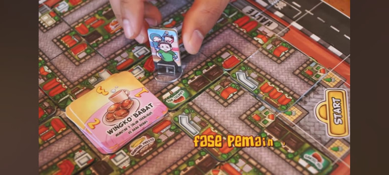 9.	Pemain dapat mengambil kartu jajanan paling atas yang ada dipusat kota.